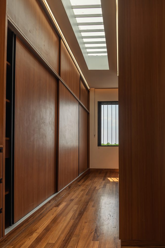 Black Rock House — Dressing corridor lit from the skylight