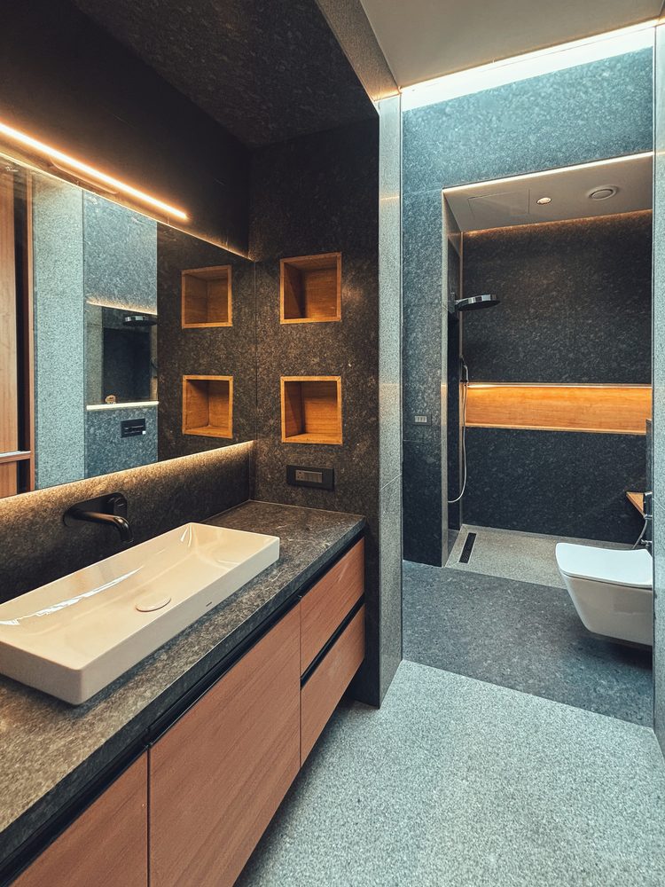 Black Rock House — Bath — granite vanity and teak niches
